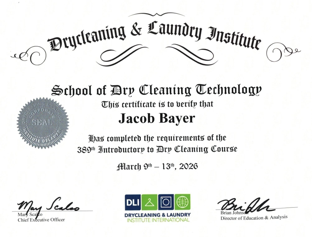 Certificate from Drycleaning & Laundry Institute awarded to Jacob Bayer for completing the 389th Introductory to Dry Cleaning Course, dated March 9-13, 2026.